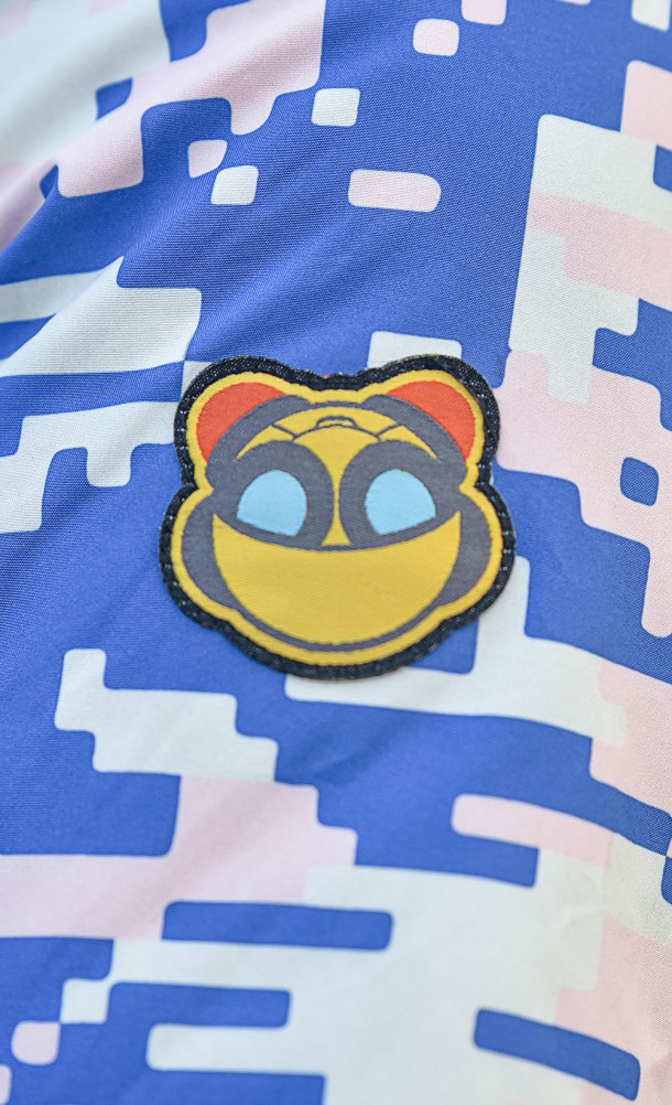 Close up detail on the sleeve print of the Rift Apart Reversible Bomber jacket from our Ratchet & Clank collection