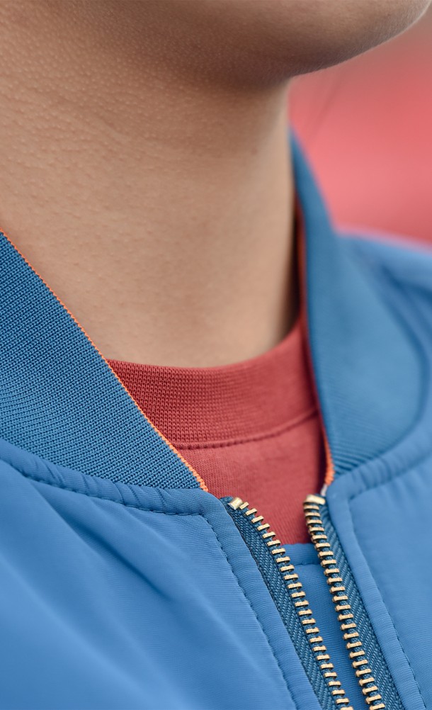 Close up detail on the collar of the Rift Apart Reversible Bomber jacket from our Ratchet & Clank collection