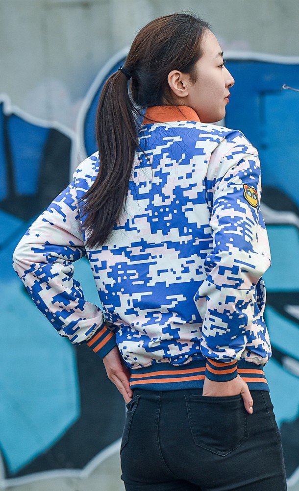 Model wearing the Rift Apart Reversible Bomber jacket from our Ratchet & Clank collection