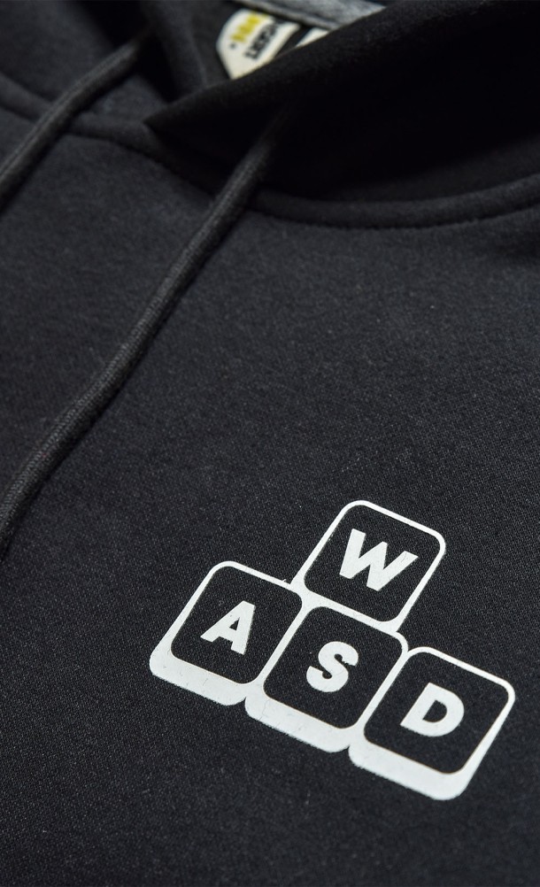 Close up detail on the chest print of the WASD hoodie from our WASD collection