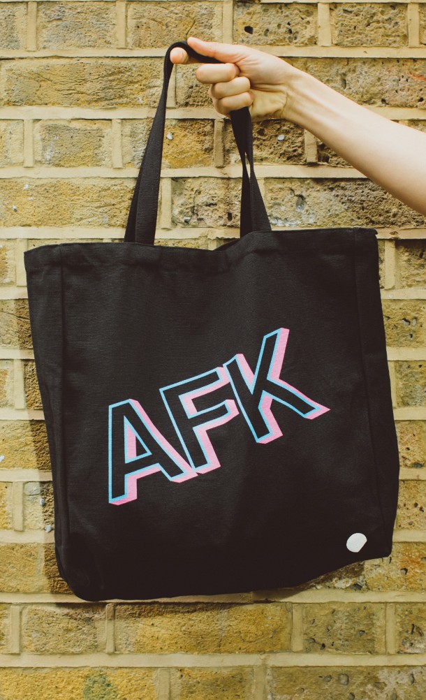 Model carrying the AFK The bag from our Insert Coin collection