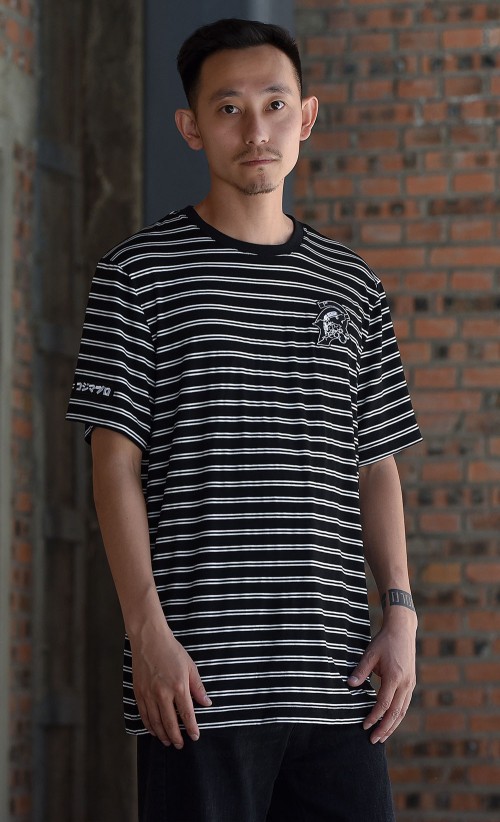 Model wearing the KP Stripe T-Shirt from our Kojima Productions collection