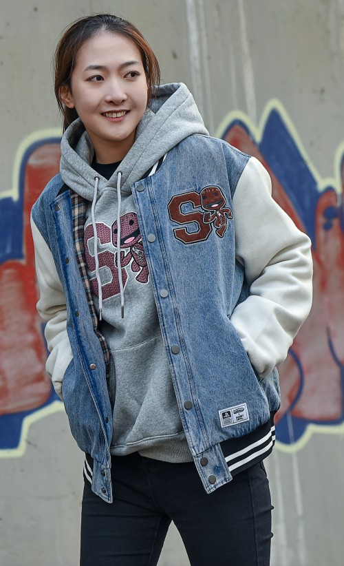 Model wearing the Sackboy Varsity jacket from our Sackboy collection