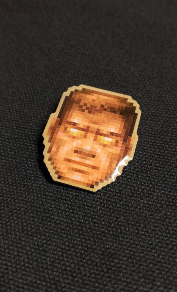 Image of the God Mode Enamel pin from our DOOM collection
