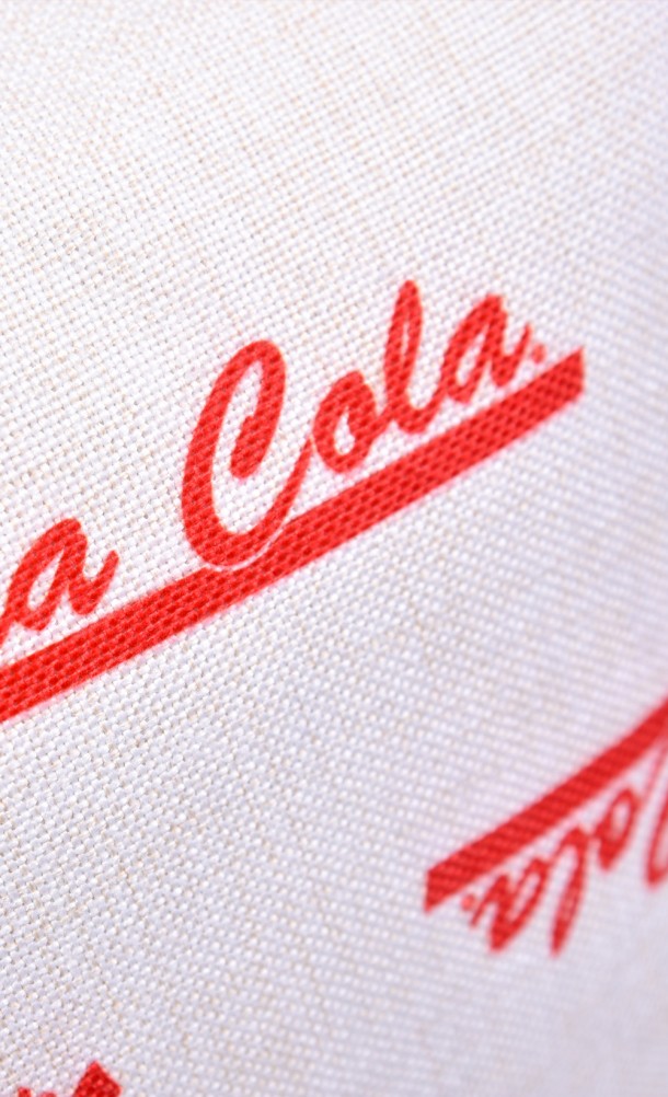 Close up detail of the Nuka Cola cushion cover from our Fallout collection