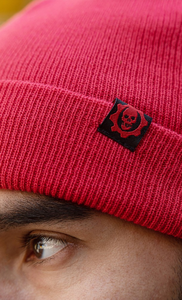 Close up detail on logo of the Crimson Beanie (RED) from our Gears of War collection