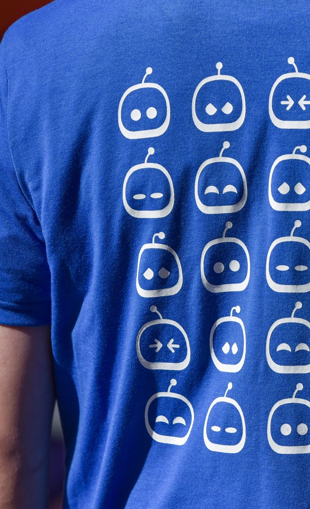Close up detail of the back print on The many faces of Astro T-shirt from our Astro's playroom collection