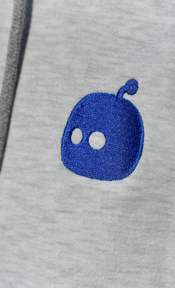 Close up on detail of embroidered chest patch on the Astro Forever hoodie from our Astro's playroom collection