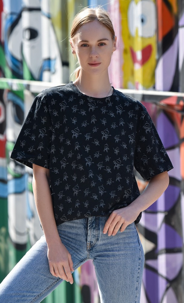 Model wearing the Astro Pattern T-shirt from our Astro's playroom collection