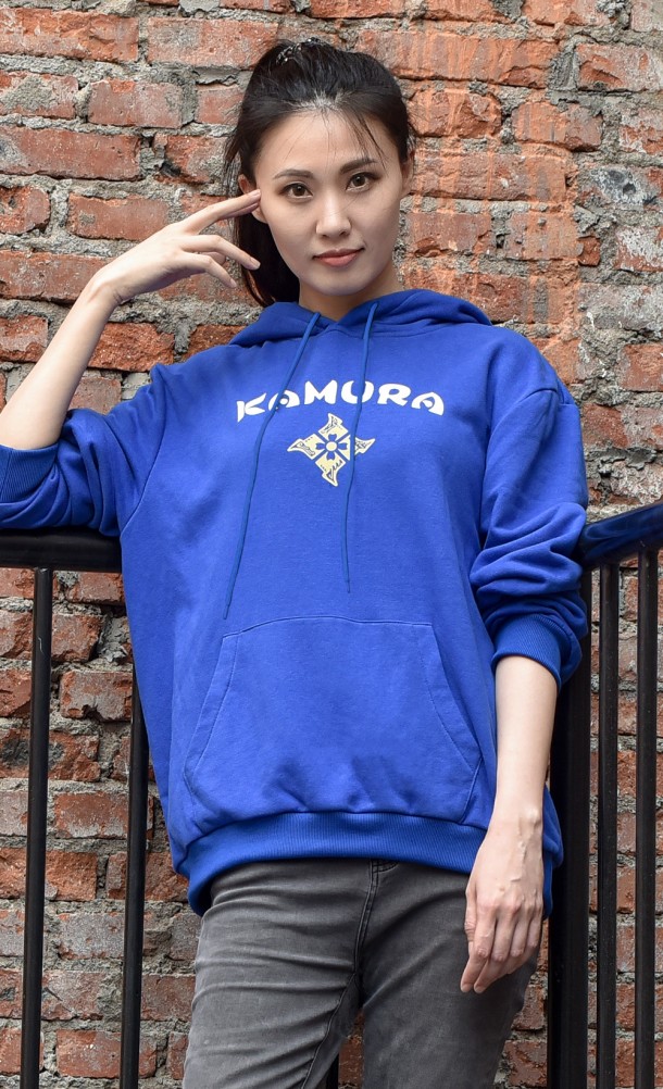 Model wearing the Kamura Hoodie from our Monster Hunter Rise collection