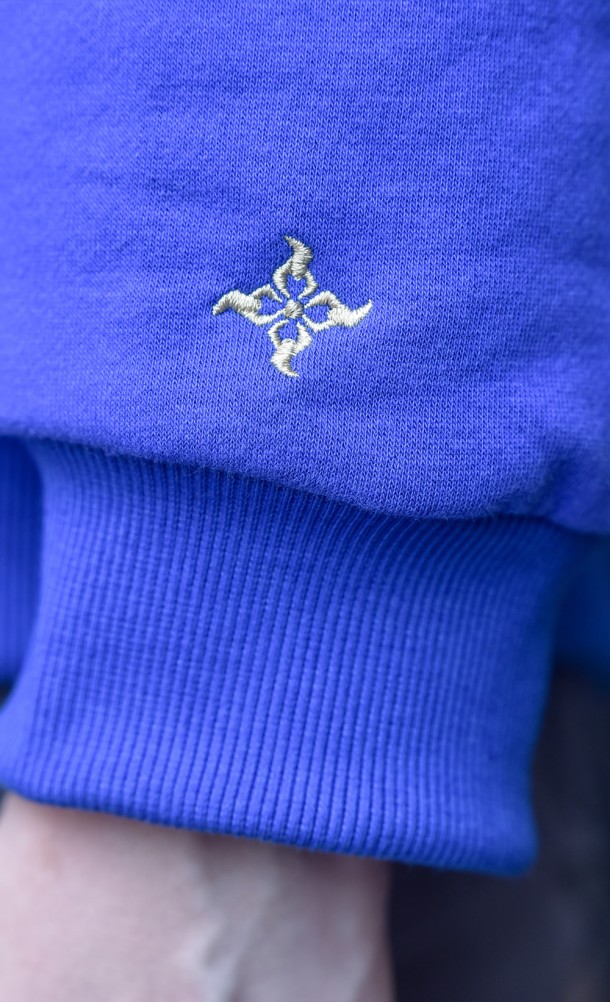 Close up detail of the arm print on the Kamura hoodie from our Monster Hunter Rise collection