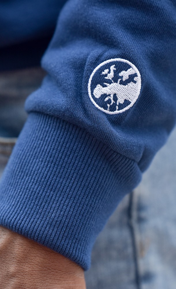 Close up detail on the arm print of the Tavern Time hoodie from our Eurogamer collection