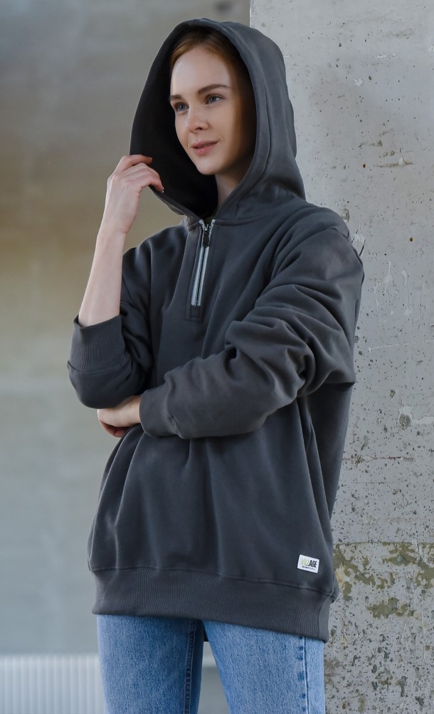 Model wearing the Ethan half-zip hoodie from our Resident Evil Village collection