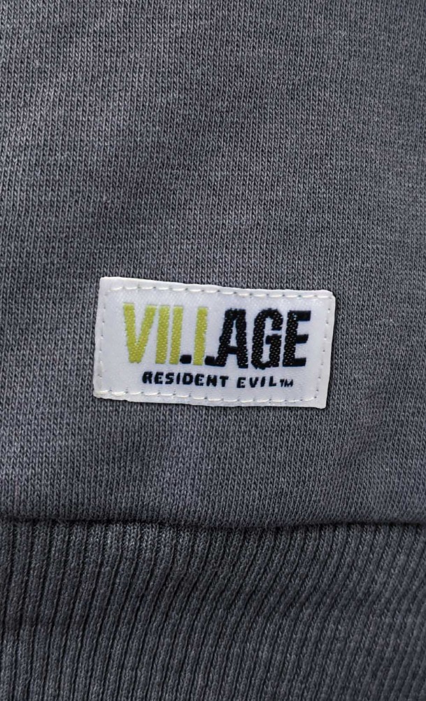 Close up detail of the front badge on the Ethan half-zip hoodie from our Resident Evil Village collection