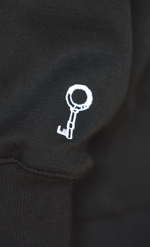 Close up detail on the arm print of the Six Hoodie from our Little Nightmares collection