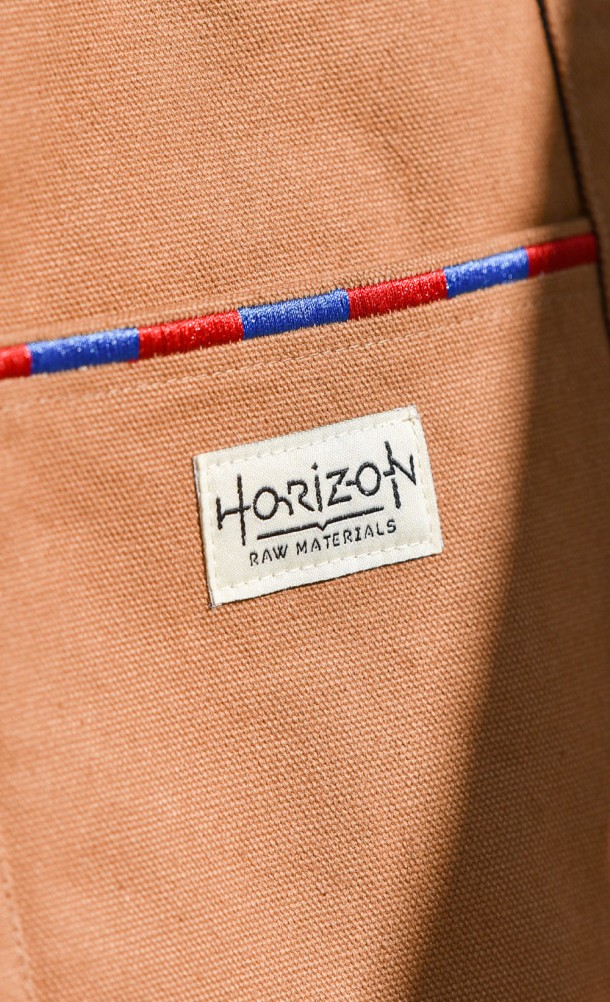 Close up detail of the front patch on the Seeker Reversible Tote bag from our Horizon Forbidden West collection