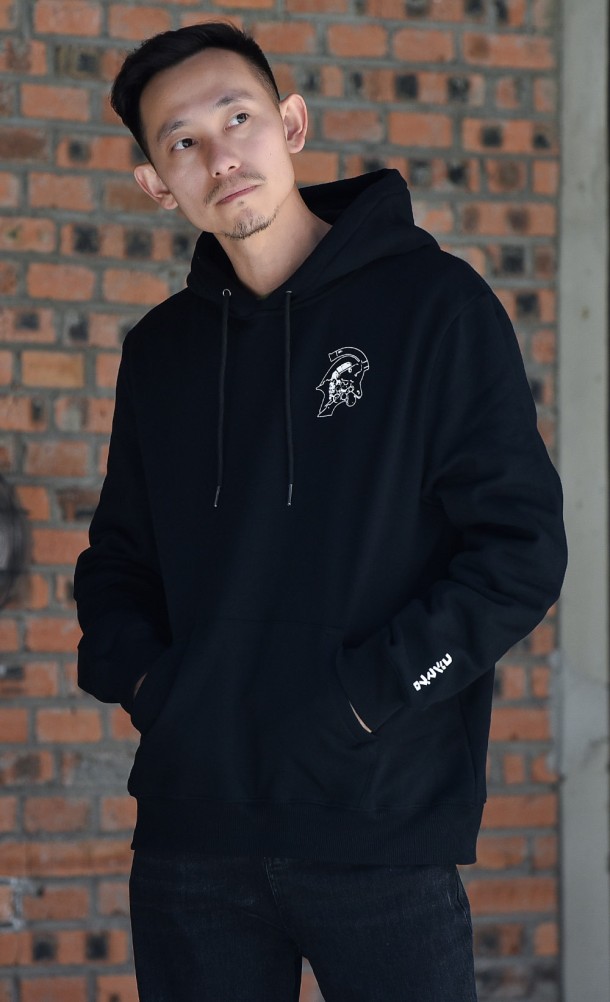 Model wearing the KojiPro hoodie from our Kojima Productions collection