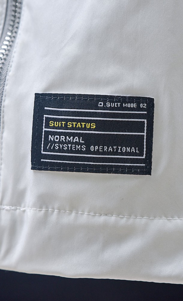 Close up detail of the front patch on the Selene Weatherproof jacket from our Returnal collection