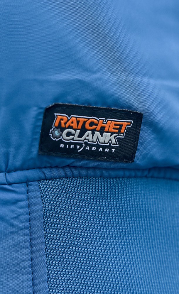 Close up detail on the front print of the Rift Apart Reversible Bomber jacket from our Ratchet & Clank collection