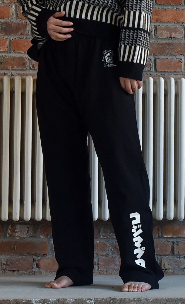 Model wearing the KojiPro Pyjama Bottoms from our Kojima Productions collection