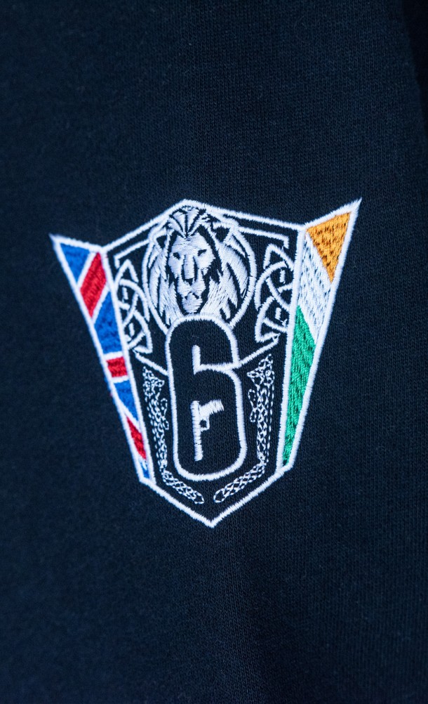 Close up detail of the embroidered emblem on the 6 siege nationals hoodie from our 6 siege collection