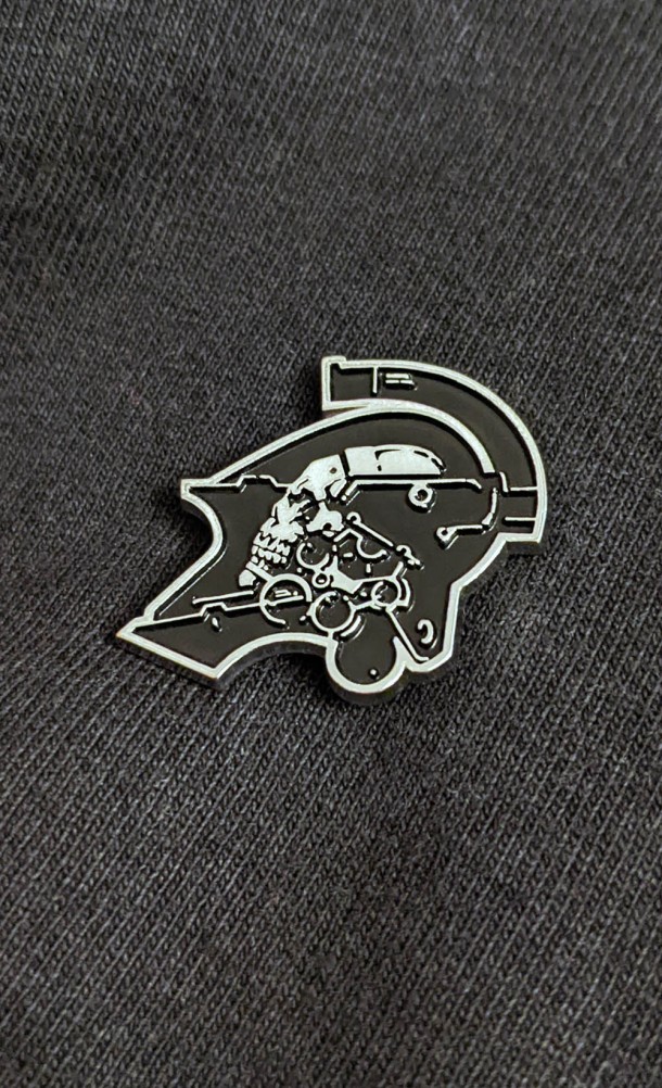 Image of the Ludens enamel pin from our Kojima Productions collection