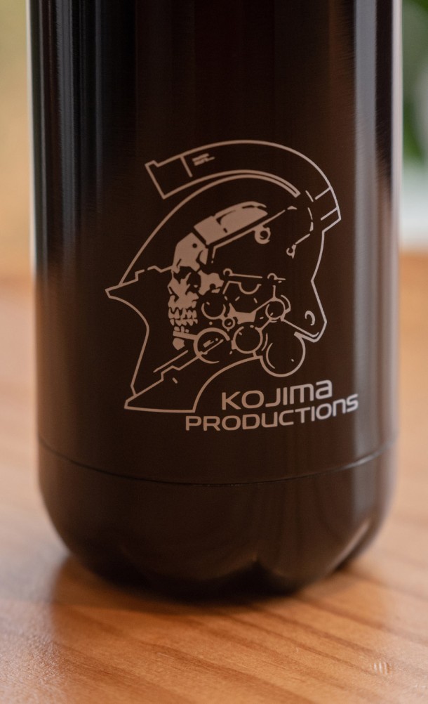 Close up detail on the print of the Kojima Productions Water Bottle in black from our Kojima Productions collection
