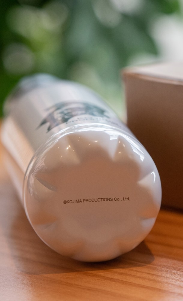 Close up detail on the bottom of the Kojima Productions water bottle in white from our Kojima Productions collection