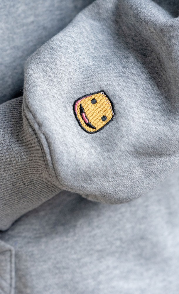 Close up detail on the sleeve print of the Sackboy Hoodie from our Sackboy collection