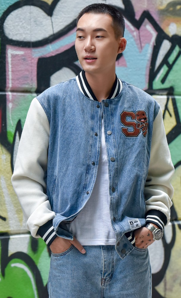 Model wearing the Sackboy Varsity jacket from our Sackboy collection