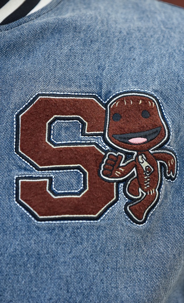 Close up detail on the chest print of the Sackboy Varsity jacket from our Sackboy collection
