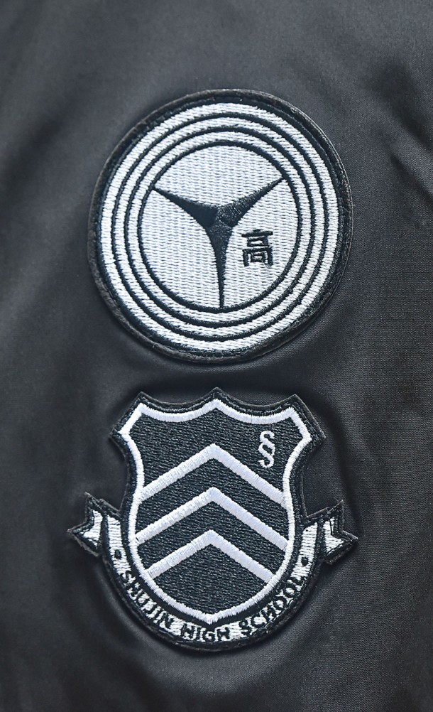 Close up detail on the front patches of the Persona 25th Anniversary Bomber jacket from our Persona 25th Anniversary collection