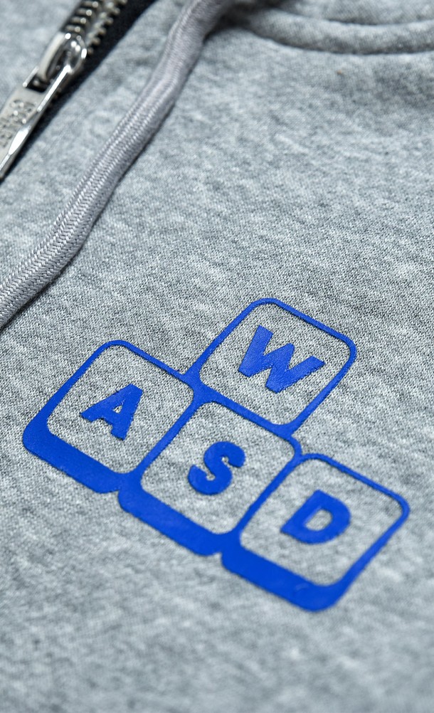 Close up detail on the chest print of the WASD ZipThru Hoodie from our WASD collection