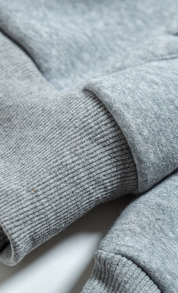 Close up detail on the sleeve of the WASD ZipThru Hoodie from our WASD collection