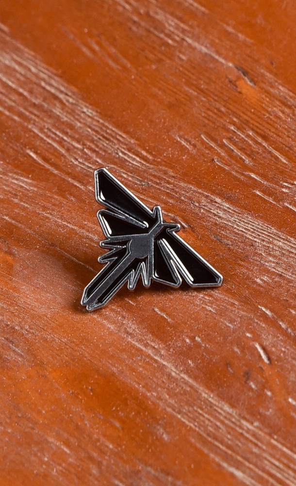 Image of the Fireflies enamel pin from our The Last of Us collection