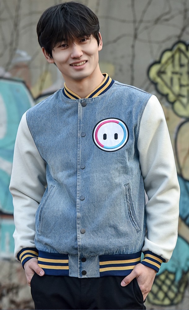 Model wearing the Retro Bean Varsity jacket from our Fall Guys collection
