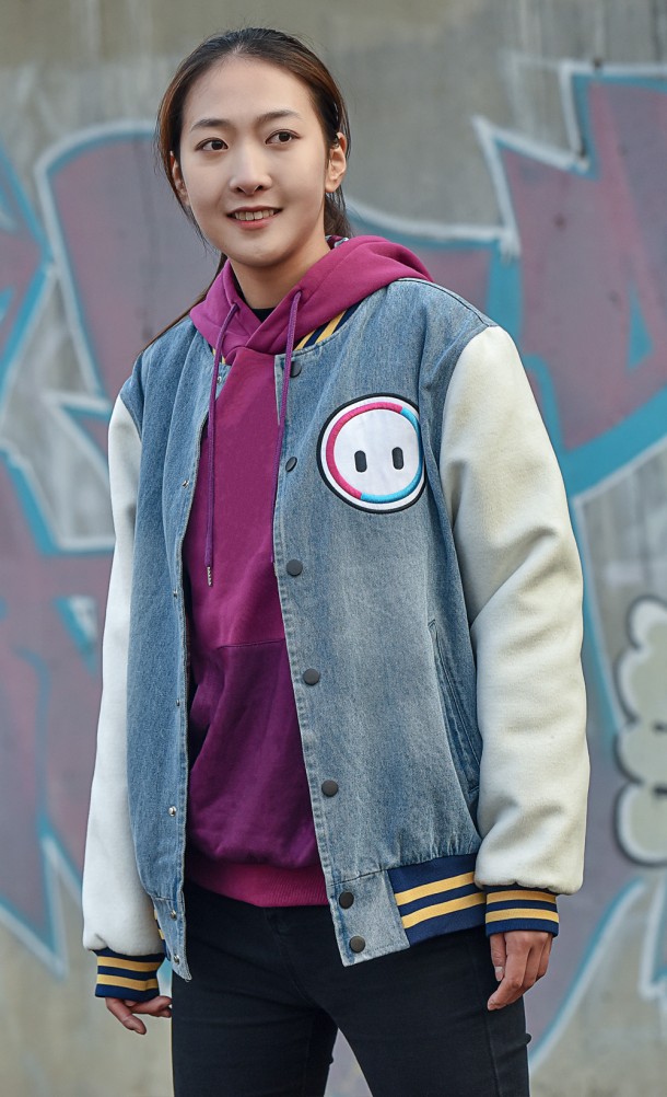 Model wearing the Retro Bean Varsity jacket from our Fall Guys collection