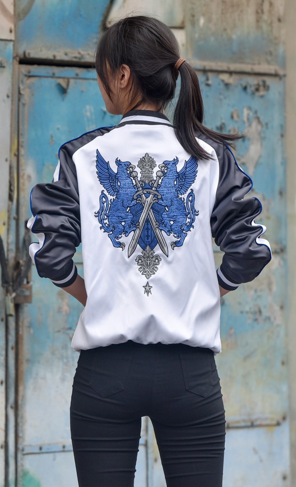 Model wearing the FFXIV Endwalker Paladin Jacket from our Final Fantasy XIV collection