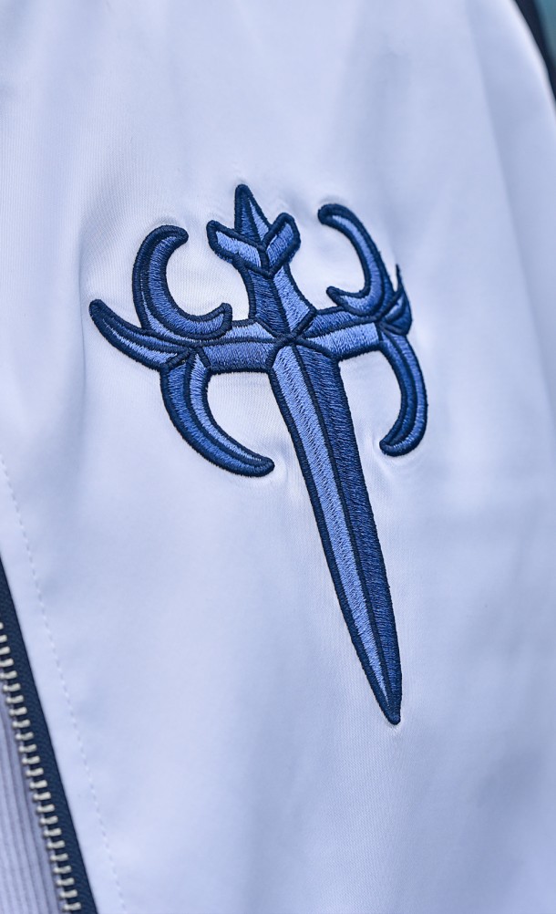 Close up detail on the front print of the FFXIV Endwalker Paladin Jacket from our Final Fantasy XIV collection