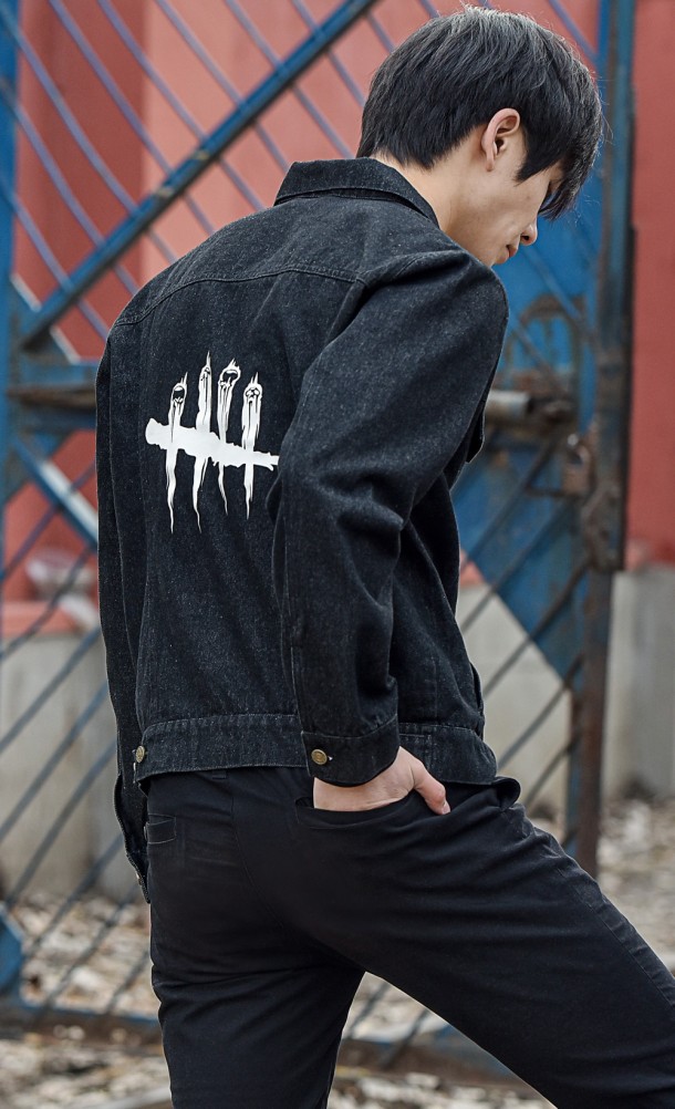 Model wearing the DbD denim jacket from our Dead by Daylight collection