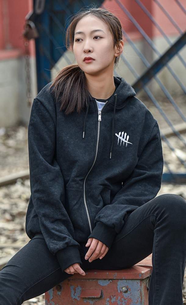 Model wearing the DbD Acid Hoodie from our Dead by Daylight collection