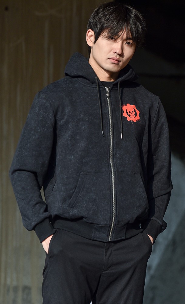 Model wearing The Lancer Acid Wash hoodie from our Gears of War collection