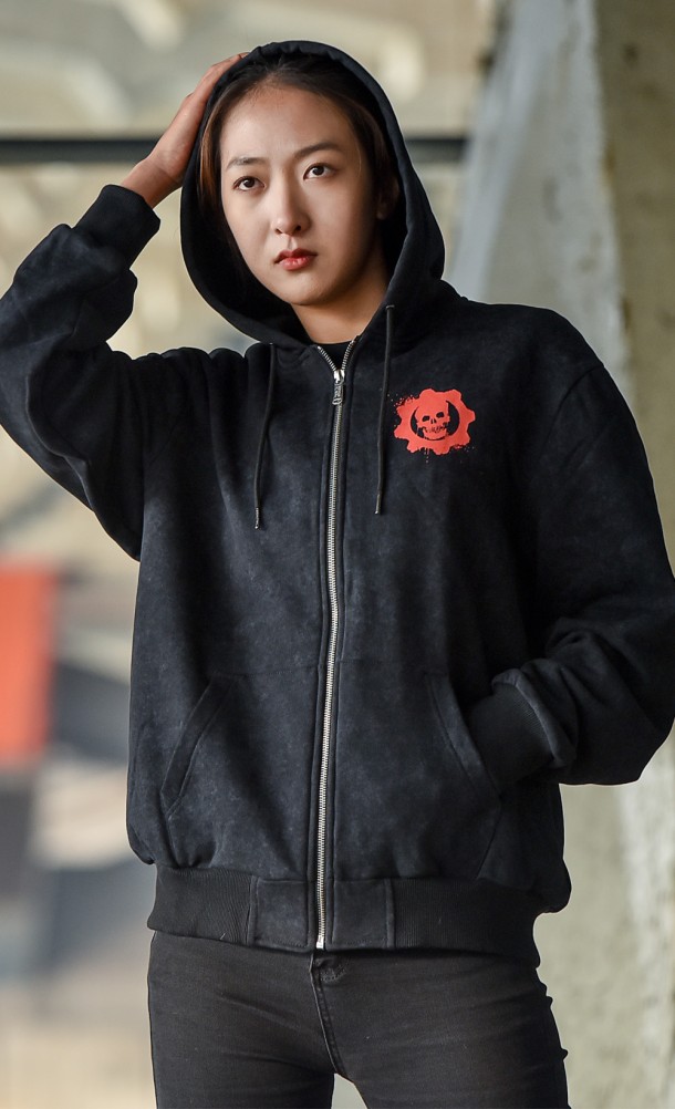 Model wearing The Lancer Acid Wash hoodie from our Gears of War collection