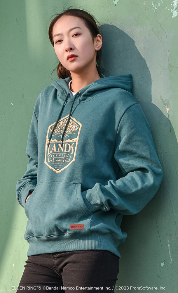 Model is wearing the Lands Between Hoodie from our Elden Ring collection